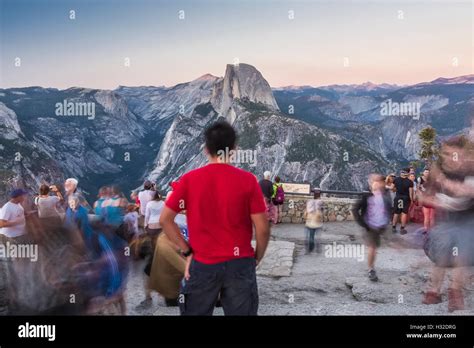 Visitors At Glacier Point Viewing The Sunset Over Half Dome And
