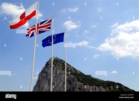 Flags Of Gibraltar Great Britain And Europe Blowing In The Wind