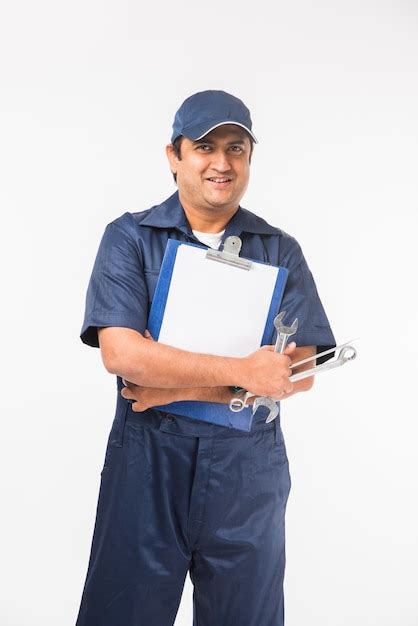 Premium Photo Indian Happy Auto Mechanic In Blue Suit And Cap