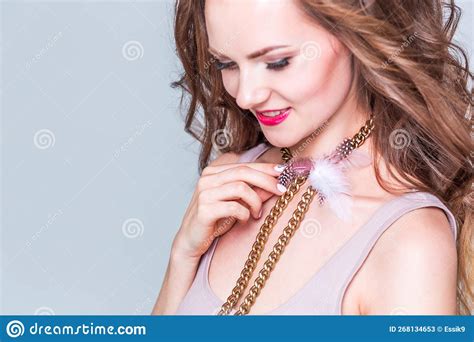 A Beautiful Choker Made Of Gold Chains White And Pink Fluff Around The