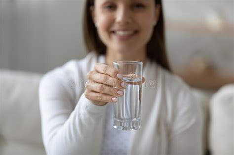Close Up Smiling Young Woman Holding Glass Of Pure Water Stock Image
