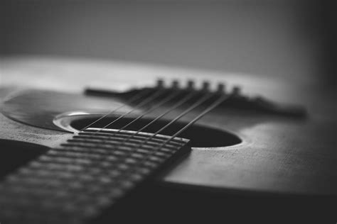Grayscale Photo Of An Acoustic Guitar · Free Stock Photo