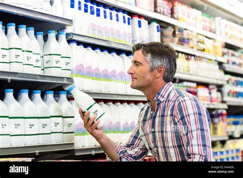 Handsome Man Buying Milk Stock Photo Alamy