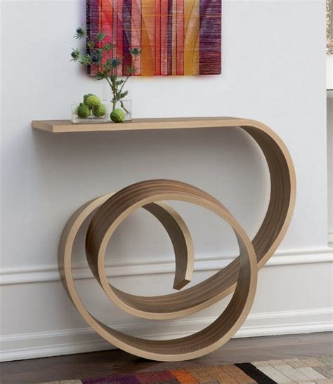 This shelf console is the perfect etagere bookshelf for use as an entryway or accent piece to keep small items within reach and add a touch of elegant decor. How To Decorate Your Entryway With Modern Console Tables