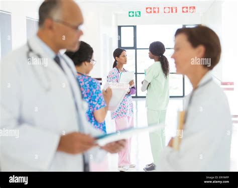 Doctors And Nurses Talking In Hospital Corridor Stock Photo Alamy