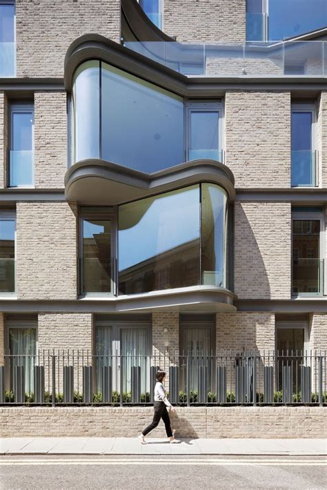 Contemporary Apartment Block In London With Bow Windows And Brick Facades