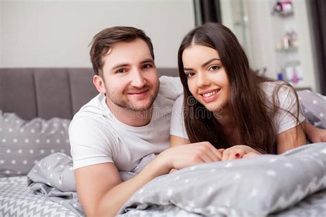Happy Sensual Young Couple Lying In Bed Together Stock Image Image Of