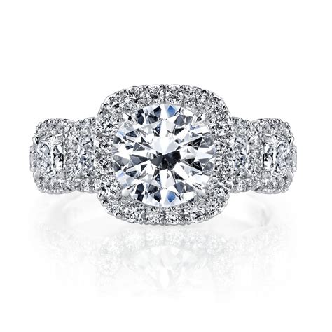 This beautiful setting style makes the center stone appear larger and creates even more. 5 Stone Cushion Halo Diamond Ring | Nicole Mera