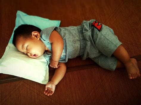 Premium Photo High Angle View Of Baby Boy Sleeping On Bed At Home