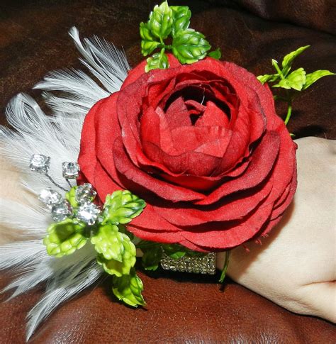 Ellie Mae Silk Flowerworks Red Ranunculus And White Feathers Corsage