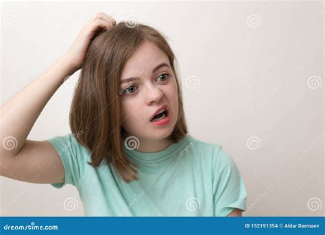 Portrait Of Young Caucasian Woman Girl With Questioning Puzzled