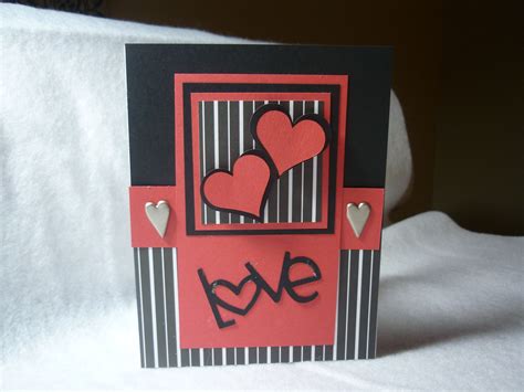 A Close Up Of A Card With Hearts On It