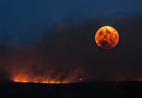 The Full Moon Rises Over Moorland Fire Jason Smalley