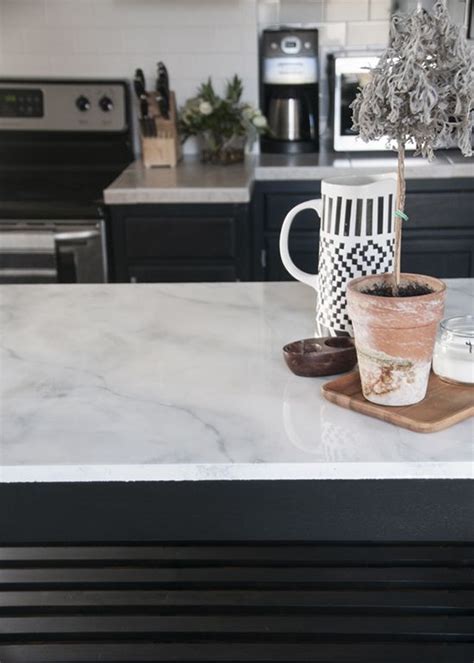 Add the marble veins by dipping the tip of the feather into the darker gray paints and dragging and wiggling it across the countertop. How To: Paint The Most Realistic Faux Marble Countertops ...