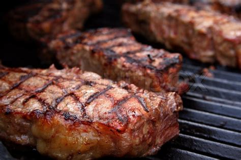 Thick Juicy Steaks On A Barbecue Grill Stock Photo Colourbox