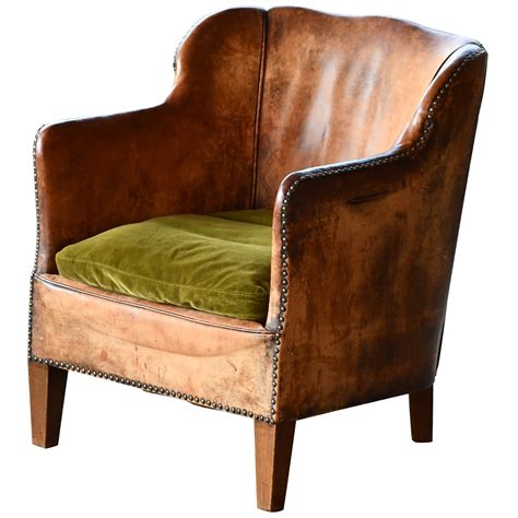 This small leather chair delivers epic comfort, from the tiniest studio apartment to a sweet attic reading nook tucked away in a farmhouse. Small-Scale Club Chair in Leather and Tartan Plaid For ...