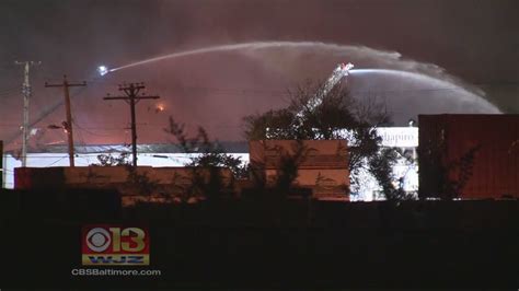 Firefighters Battle Hot Spots From Massive Warehouse Fire Overnight