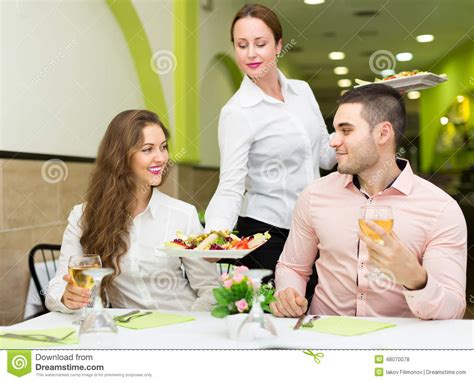 Female Waiter Serving Guests Table Stock Photo Image Of Girl Male