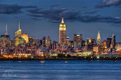 The View Of Midtown Manhattan At Night From The Liberty State Park In