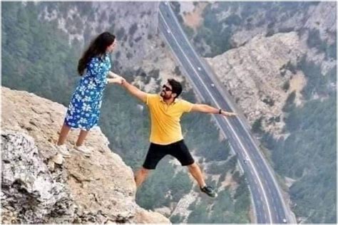 Dangerous Or Photoshop Viral Photo Of Couple Hanging From A Cliff Has Left Twitter On The Edge