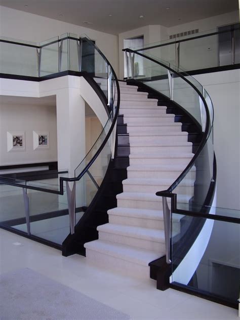 Glass staircase enclosures serve as a stylish addition to modern and minimalist interiors. Curved Staircase With Glass Balustrade - Modern ...