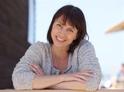Confident Middle Aged Woman Smiling Outside Stock Photo Image Of