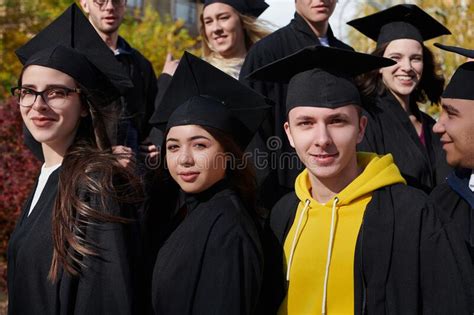 Group Of Diverse International Graduating Students Celebrating Stock