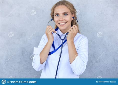 Happy Smiling Female Doctor In White Uniform Coat And Stethoscope