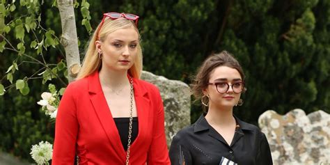 They were showered in confetti. Sophie Turner and Maisie Williams at Kit Harington and Rose Leslie's Wedding - Matching