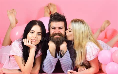 Man With Beard And Mustache Attracts Blonde And Brunette Girls Threesome On Smiling Faces Lay