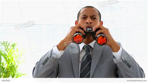 Curious Businessman Looking Through Binoculars Stock Video Footage