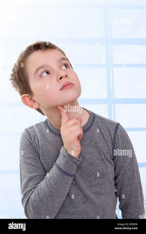 Eight Years Old Kid Looking Up Thinking Wondering About Something