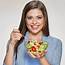 Portrait Young Woman Eating Salad Beige Background Healthy Food Concept 