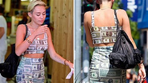 Miley Cyrus Shops Bra Less In A Cash Print Crop Top And Mini Skirt