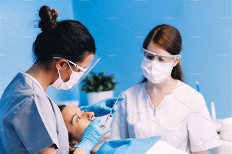 Dentists With A Patient Featuring Dental Dentist And Dentistry