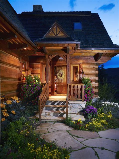 The Landscaping Really Showcases The Front Of The Porch Of This Cabin