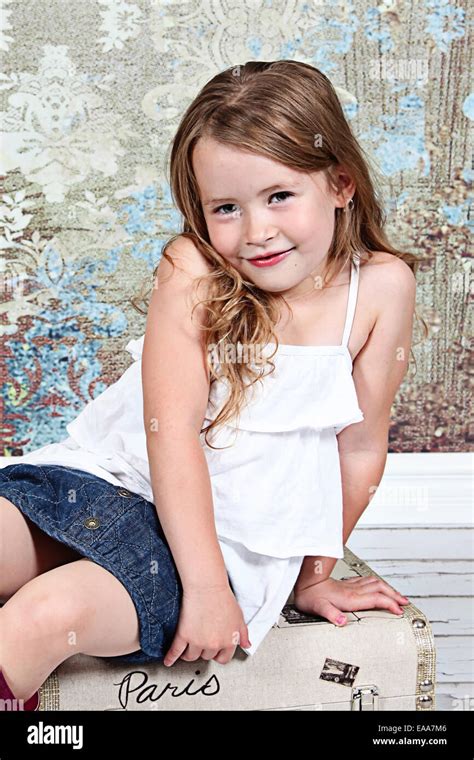 Beautiful Little Girl Posing For Camera In Studio Stock Photo Royalty