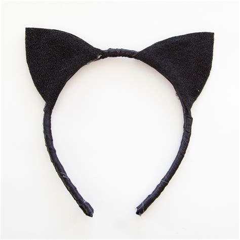 I always link back to original source. Designer Cat Ears DIY by Trinkets in Bloom