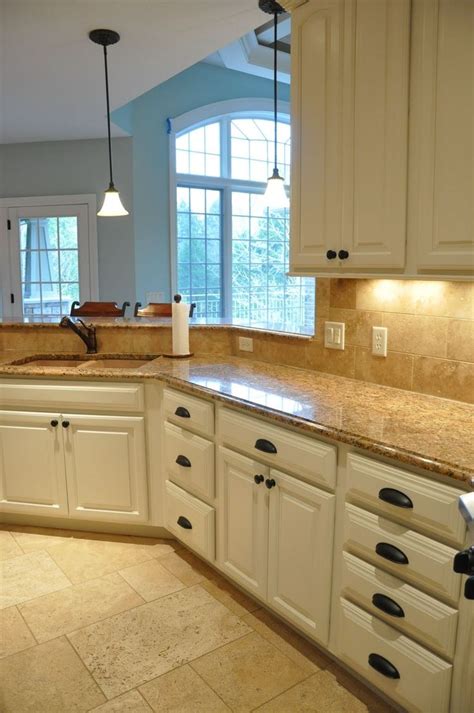 A coat of white paint can brighten up any space, while some people prefer the natural look of wood, and. Painting Kitchen Cabinets Before and After ...