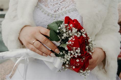 Woman Holding Red Rose Bouquet · Free Stock Photo