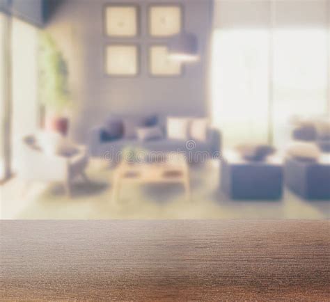 Wooden Table Top With Blur Background Of Modern Living Room Interior