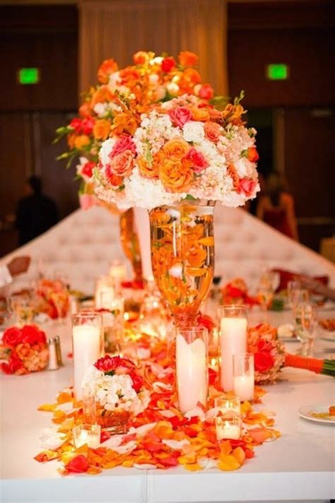 Spruce up your wedding cake with fresh flowers to produce a complex twist on the tiered wedding. Wedding Stuff Ideas: Orange Wedding Decoration