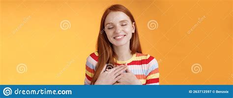 Happy Romantic Delighted Sighing Young Lovely Redhead Girlfriend Smiling Broadly Touching Heart