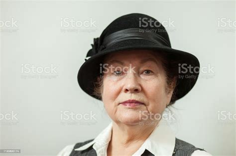 Studio Portrait Of A 70 Year Old Woman Stock Photo Download Image Now