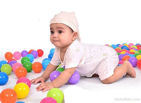 Baby Playing With Balls