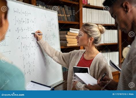 College Student Solving Math On Whiteboard Stock Photo Image Of