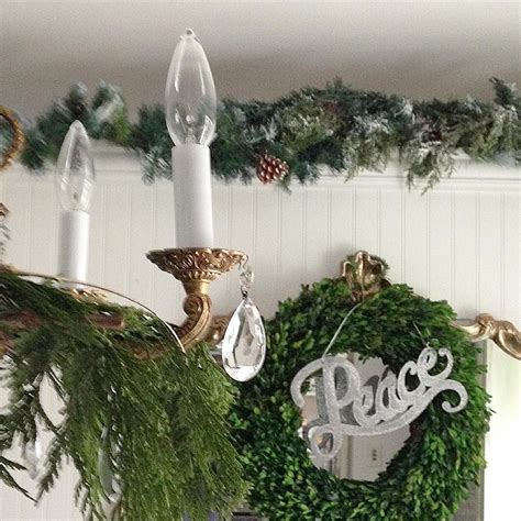 Christmas in the kitchen with mini wreaths on cabinet doors. Garland above kitchen cabinets. (With images) | Above kitchen cabinets, Table decorations, Decor