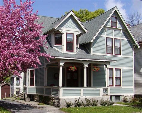 Here we see medium gray siding with a black front door black roof white trim and the perfect light gray colored stone veneer. Pin on victorian houses