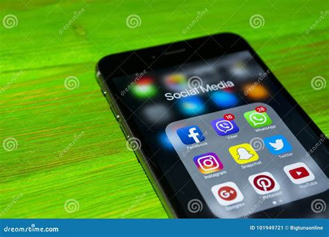 Iphone 7 Plus With Icons Of Social Media On Screen On Green Wooden