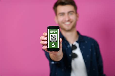 Covid Passport A Young Man Shows His Qr Code And Covid19 Passport On